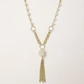 Long gold-plated necklace with freshwater pearls, chunky chain links, and flowing tassel pendant